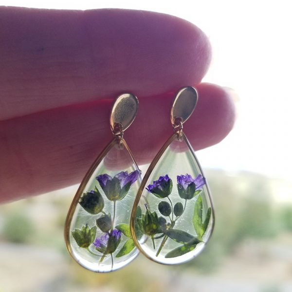 Simplistic in design these teardrop gold dangle earrings feature real dried wildflowers found in the Pacific Northwest.