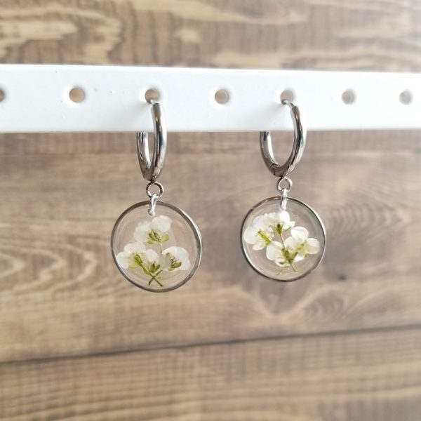 Add a touch of whimsy to your accessory collection with these Dried Alyssum Flower Resin Dangle Earrings.