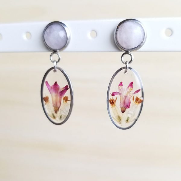 Add a touch of whimsy and natural beauty to your jewelry collection with these rose quarts dried wildflower earrings.