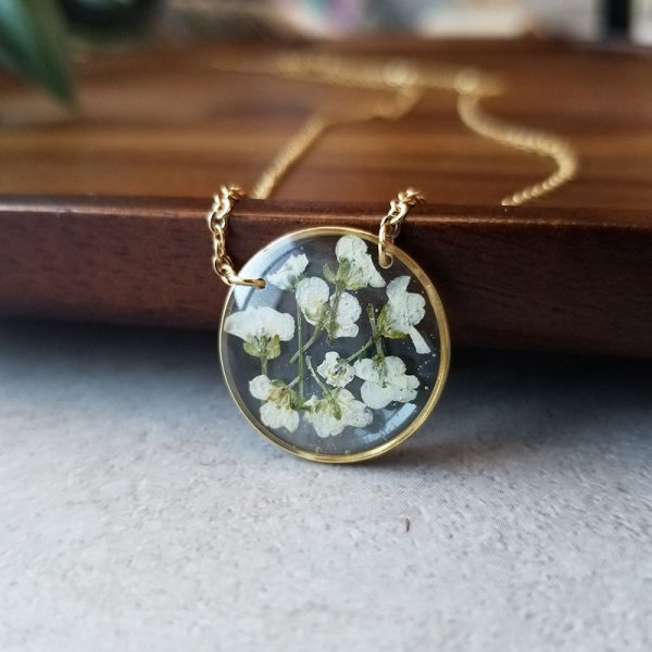 Add a touch of whimsy to your wardrobe with this one of a kind Alyssum dried flower resin Necklace.