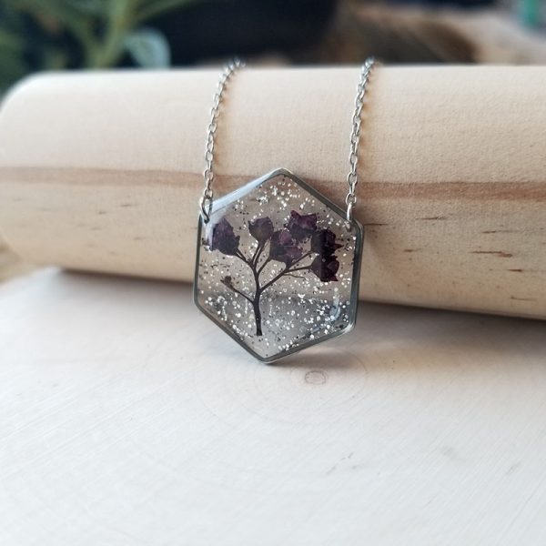 This pressed Spirea bush buds silver glitter necklace is the perfect gift for that special someone who loves flowers and plants.