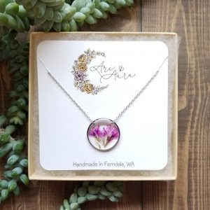The bright pink petals from the Sea Thrift bush plant will surely catch your eye with the vibrant color yet soft texture. Pressed, Dried and then carefully placed in a resin filled open bezel this necklace is sure to be enjoyed for many years to come.