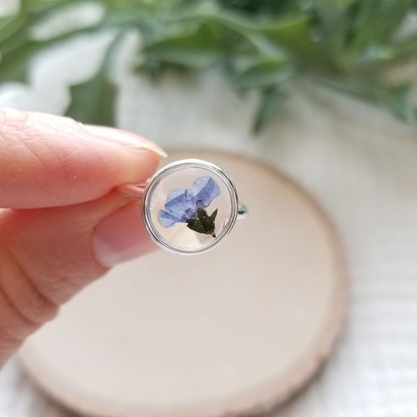 Bring a little piece of nature with you where ever you go with this beautifully crafted one of a kind forget me not flower resin silver ring.