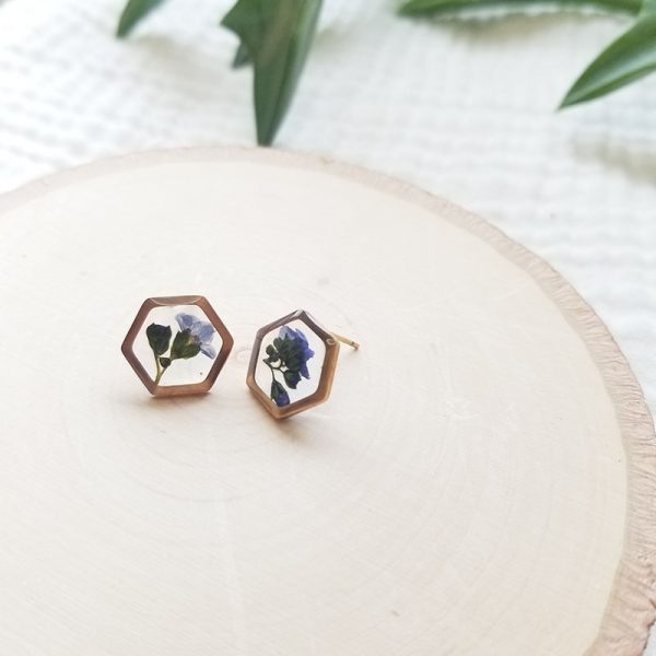 In addition to adding a pretty shade of blue to your accessories, Forget me not flowers are rich in symbolism. They symbolize true love making these hexagon stud earrings the perfect gift for someone special.