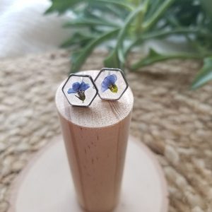 In addition to adding a pretty shade of blue to your accessories, Forget me not flowers are rich in symbolism. They symbolize true love making these hexagon stud earrings the perfect gift for someone special.
