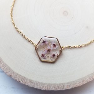 Add a touch of whimsy to your wardrobe with this one of a kind tiny wildflower gold resin bracelet.